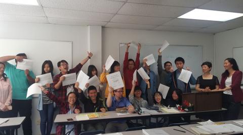 Beijing Economic Management School students with graduation certificates, Summer 2017